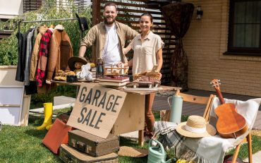 portrait-of-couple-selling-garage-stuff-in-backyard.jpg